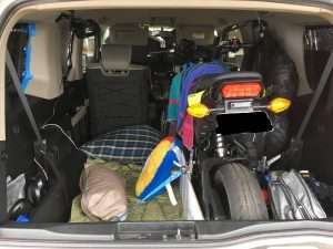 honda element with a honda grom inside and a bed platform